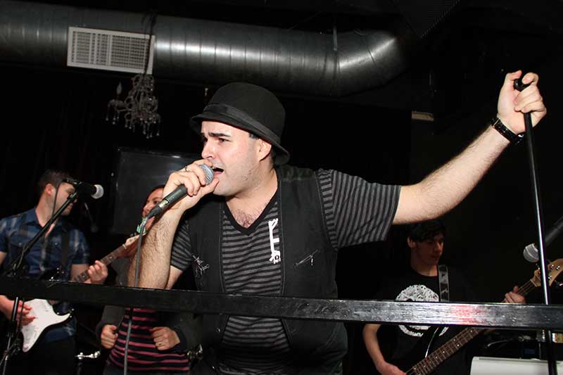 Vocal lessons student singing on stage