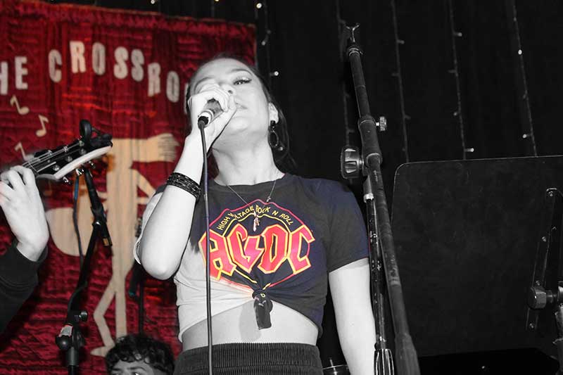 Teen singing rock songs on stage